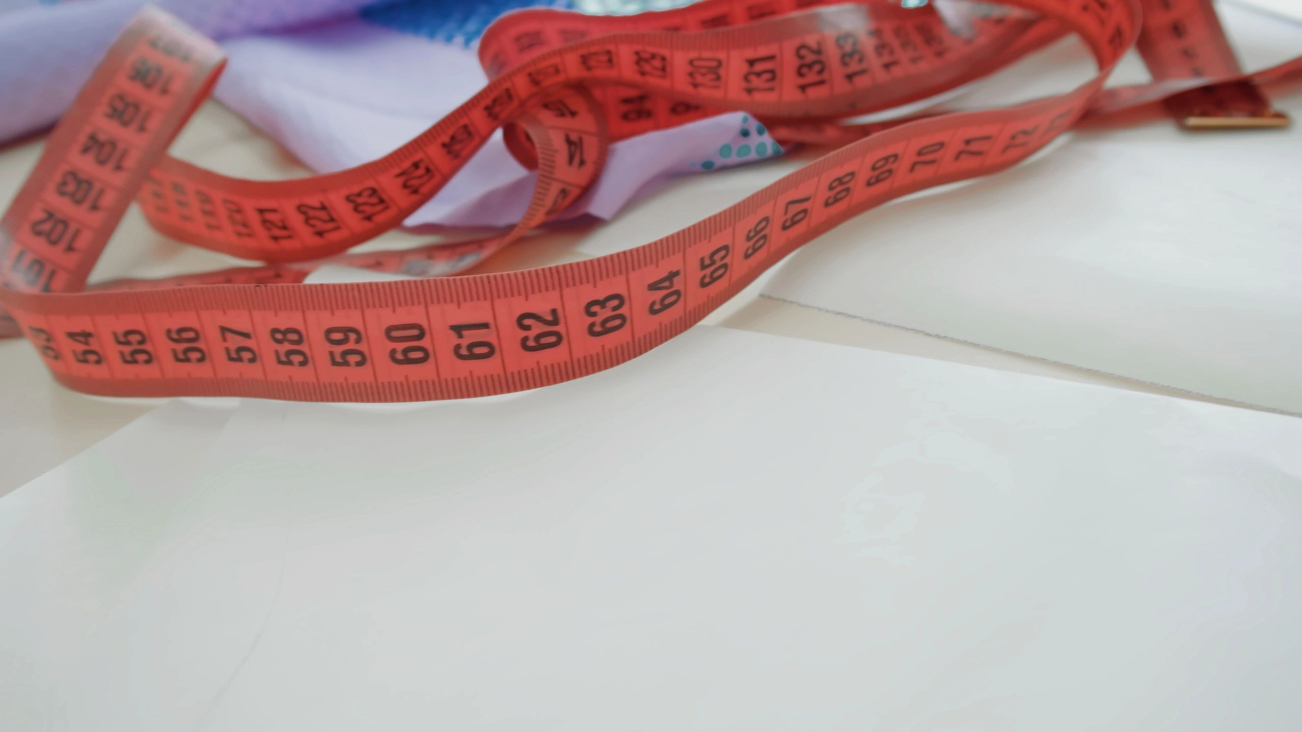 Measuring tape on a clean surface for sizing reference